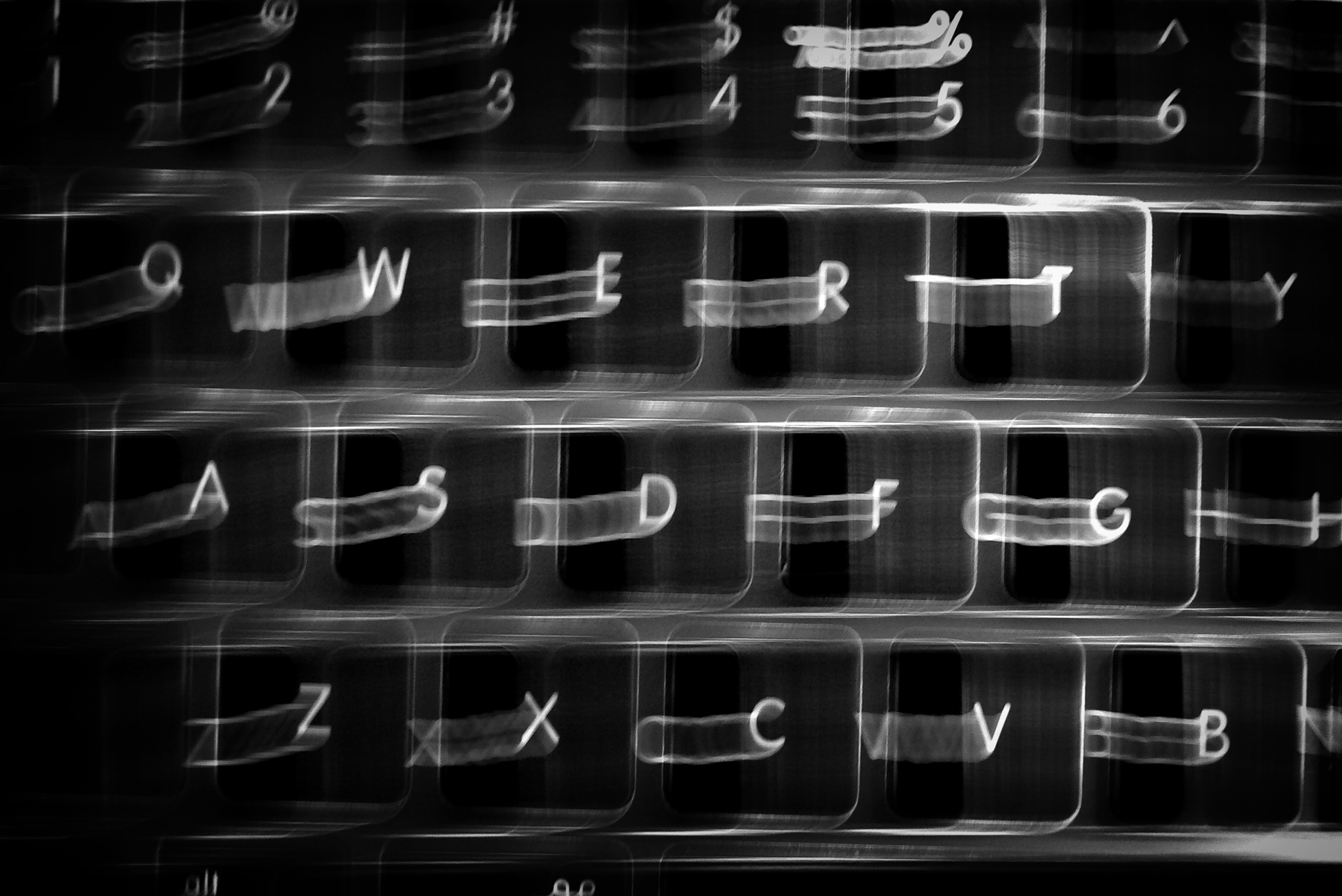 Close-up and motion-blurred image of a computer keyboard.