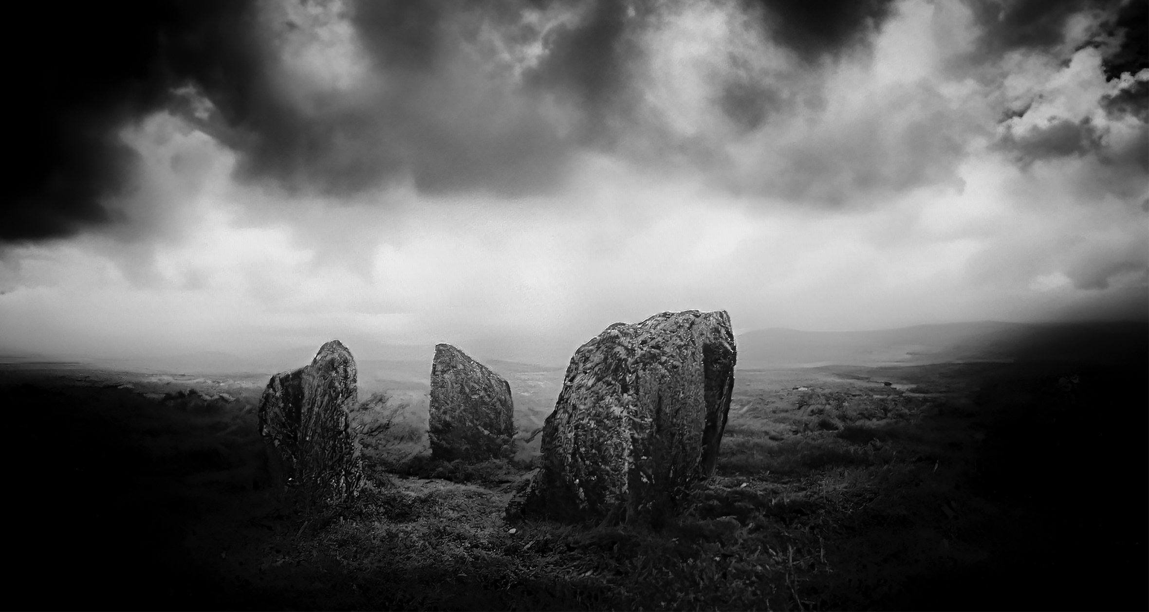 An ancient stone circle in Ireland on a very cloudy day.